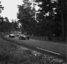 Bill Spear in a Ferarri 340 stalks Bill Pollack's Allard in 1956. Photo: Ralph Poole